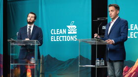 Greg Blackie, left, a supporter of Proposition 144, debates referendum foe Randy Keating Thursday night.