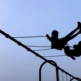 Children play on swings during National Night Out, Tuesday, August 1, 2023, in Salisbury, Maryland. (Julia Nikhinson/AP)