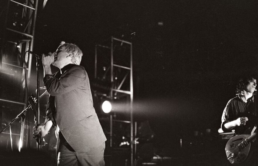 Michael Stipe (left) and Peter Buck (right) performing in Ghent, Belgium in 1985.