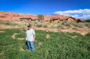 Farmer Gary Wilson stands in one of his alfalfa fields in Moab, Utah, Sept. 17, 2024. For years, he also farmed the land next to this field, but it has been developed into large homes in recent years.