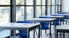 Papers on desks by window in classroom. (Getty Images)