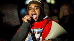 Erica Garner, daughter of Eric Garner, leads a march of people protesting the Staten Island, New York grand jury's decision not to indict a police officer involved in the chokehold death of Eric Garner in July, on Dec. 11, 2014. (Andrew Burton/Getty Images)