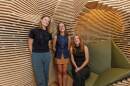 Professor Katie Stranix, left, Nina Accousti, middle, and Catherine Kazel pose together in the completed reflection room they helped to create.