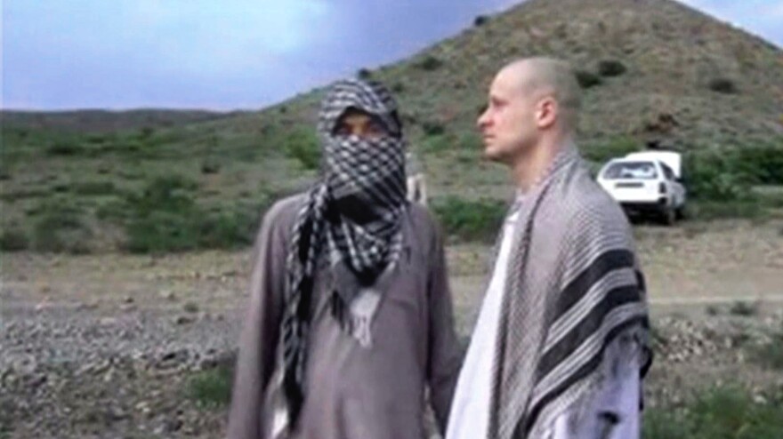 Bergdahl (right) stands with a Taliban fighter in eastern Afghanistan, in this image taken from video obtained from Voice Of Jihad Website. Bergdahl was held captive for five years before his release last year.