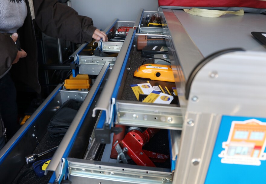 Tera James looks through drawers of small hand tools available at the SEAC mobile tool shed van at the Willie W. Lightfoot R-Center on Flint Street in Rochester on Thursday, November 20, 2025. This was the first appearance of the traveling tool shed in the neighborhood, where residents can sign up and borrow tools.