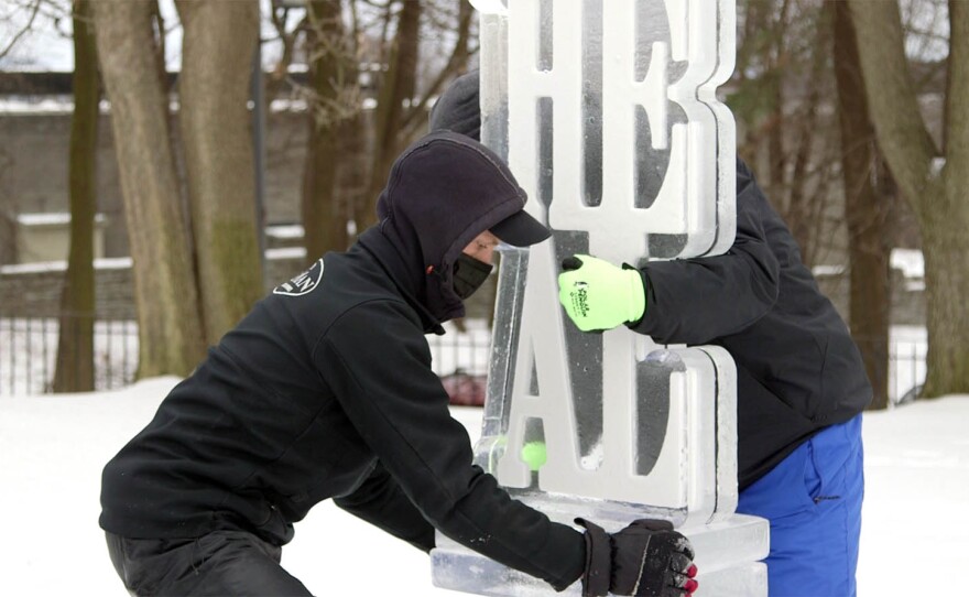 Installing an ice sculpture at the Hyde Collection