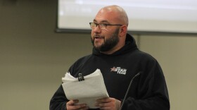 Aaron Andrews, a father whose kids attend OK Elementary School, presented board members with a petition against proposed school closures. He says the petition has between 600 and 700 signatures.