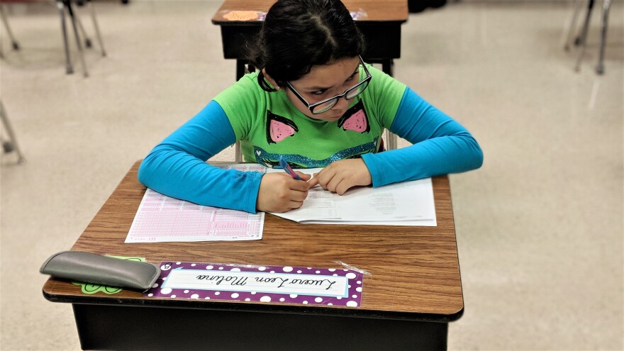 Lucero, a third grader at Smith Elementary School in Burlington, works on a practice test the week before the EOGs.