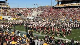 University of Arizona’s Pride of Arizona Marching Band performs with the ASU band