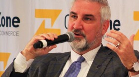 Gov. Eric Holcomb speaks to a local chamber of commerce on Aug. 17, 2022.