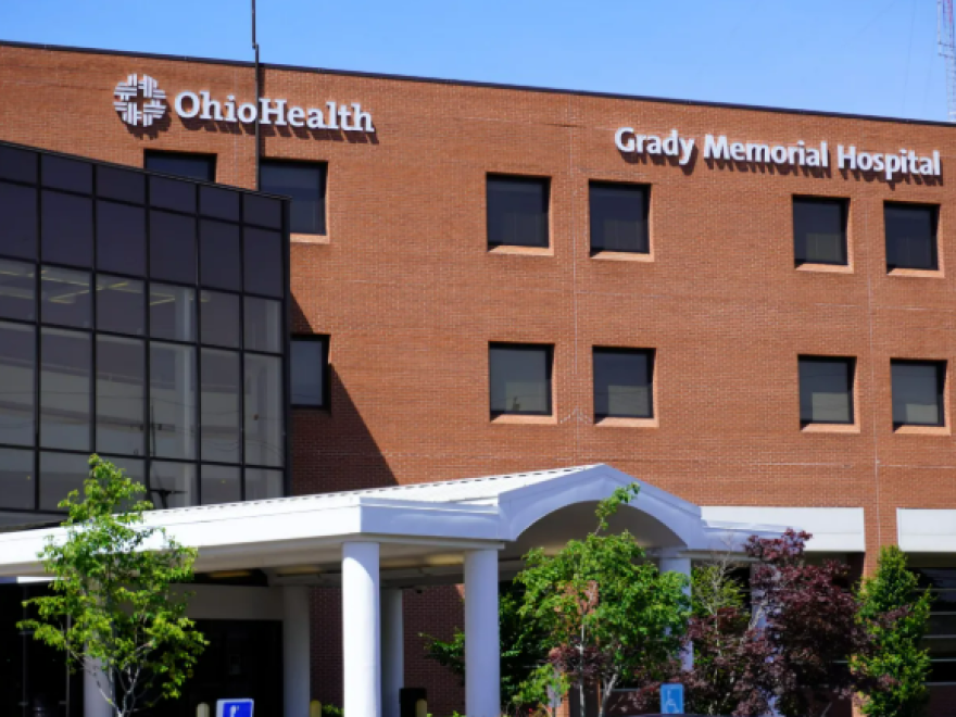 A photo shows Grady Memorial Hospital on a sunny day.
