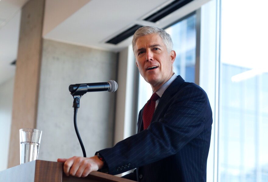 Judge Neil Gorsuch of the 10th U.S. Circuit Court of Appeals   makes a point while delivering prepared remarks before a group of attorneys last Friday at a luncheon in a legal firm in lower downtown Denver.