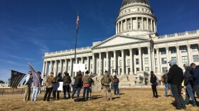 Less than 20 demonstrators showed up at the Utah State Capitol Sunday. They were far outnumbered by law enforcement, reporters and spectators.
