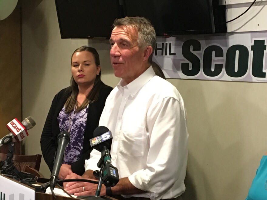 Gov. Phil Scott speaks at a podium following The Associated Press calling him the winner of the Republican gubernatorial primary race.