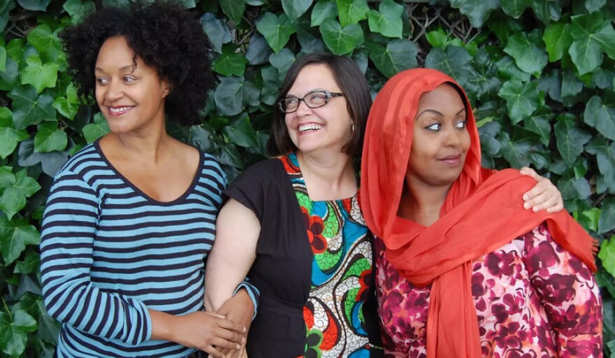 The Stoop hosts and producers Leila Day (left) and Hana Baba (right) photographed with Julie Caine, Supervising Senior Editor of Throughline (center)