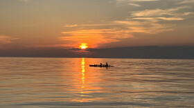 A pair of boaters at sunset on July 10, 2026, on Lake Ontario near Webster, New York.