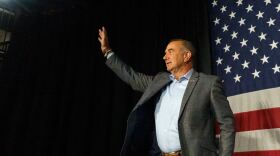 Lt. Gov. Mike Kehoe raises a hand to the crowd after claiming victory in the Missouri governor race on Tuesday at the Capital Bluffs Event Center in Jefferson City.