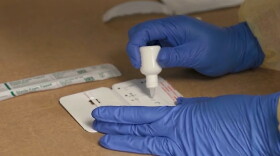  Some Kansas school districts plan to use rapid-response COVID-19 tests to track infections and control the spread.
