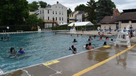 People in the water at a public pool