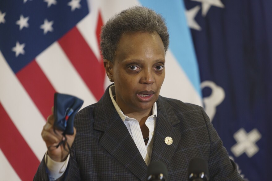 Mayor Lori Lightfoot emphasizes the importance of wearing a mask as she provides an update about the COVID-19 vaccinations at Norwegian American Hospital in Chicago on Tuesday, Jan. 5, 2021.
