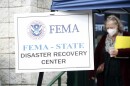 People gather at a FEMA Disaster Recovery Center at A.C. Reynolds High School in Asheville, N.C.,, Tuesday, Oct. 15, 2024.