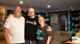 Trent Landreth (middle) is the creator behind Drawings by Trent. His mother (right) and father (left) help with him record his viral drawing videos and manage his business.