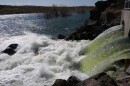 Water rushes through a tunnel into a man-made lake in the Magic Valley desert.  