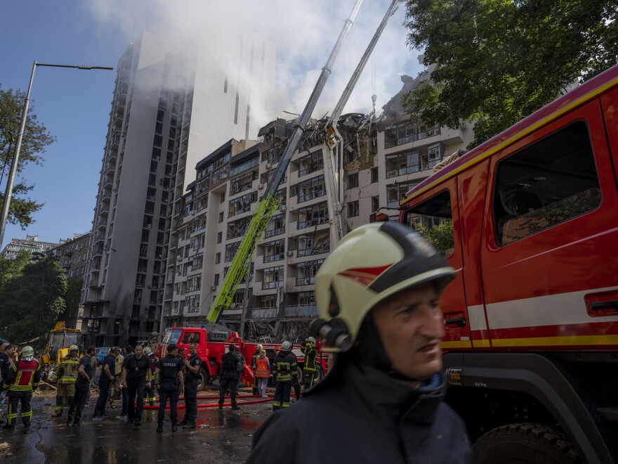 Firefighters work to rescue residents and put out a fire after a Russian missile hit an apartment building in Ukraine's capital Kyiv on Sunday morning. As President Biden and other leaders of the Group of 7 nations meet in Germany, Russia has unleashed a barrage of airstrikes across Ukraine over the weekend.