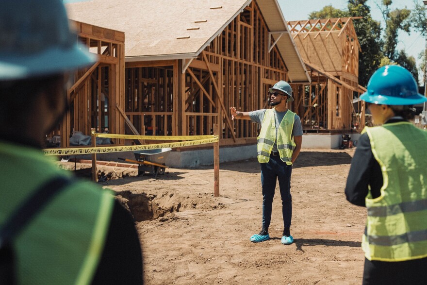 TruEvolution CEO Gabriel Maldonado seen giving a tour of the Project Legacy construction site.