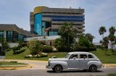An antique car passes the Melia Habana Hotel in Havana, Cuba, Tuesday, July 21, 2026.