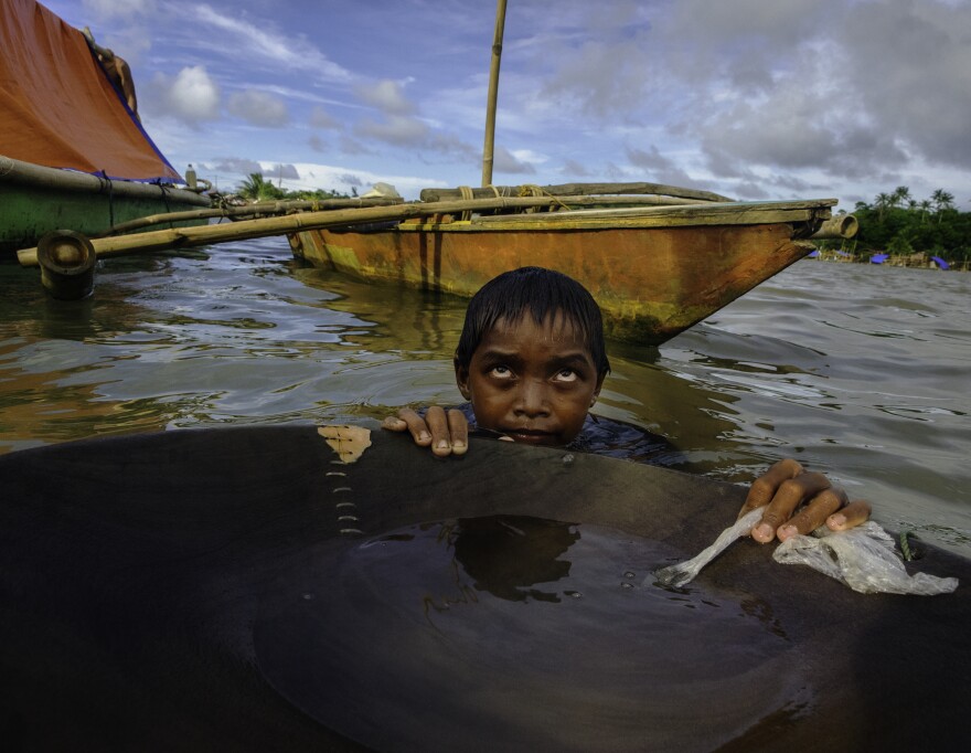 Jonathan Ramorez was 12 when Price photographed him panning in dirty water all day.