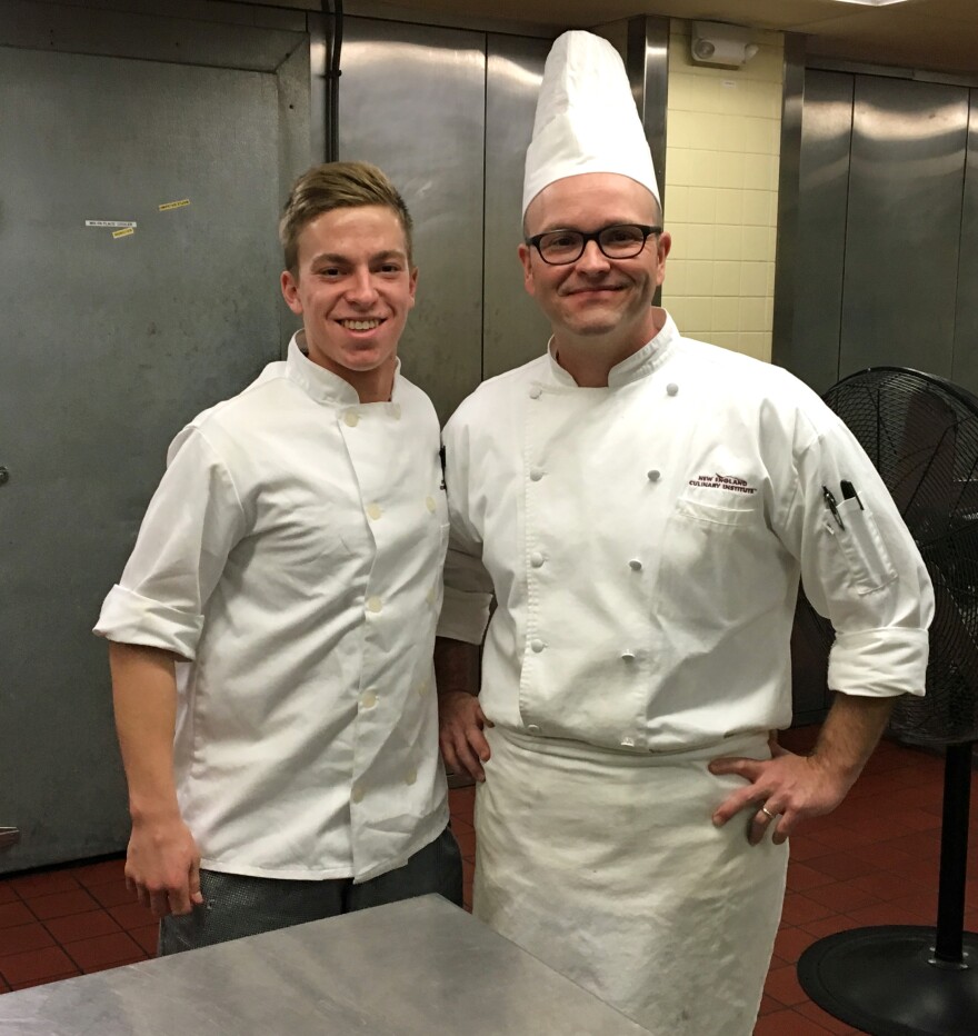 NECI student Tyler Comeau (left) and Chef Mike Dewes were among the volunteers who put together 420 entrees for the Twin Valley Senior Center.