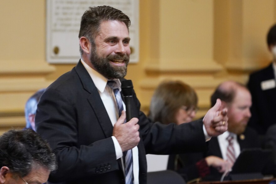 Virginia Del. Nick Freitas, R-Culpeper, gestures during the House session at the Capitol Monday Jan. 31, 2022, in Richmond, Va. (AP Photo/Steve Helber)