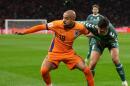 Dutch forward Donyell Malen, in orange, at the Netherlands' World Cup qualifying match against Lithuania. 