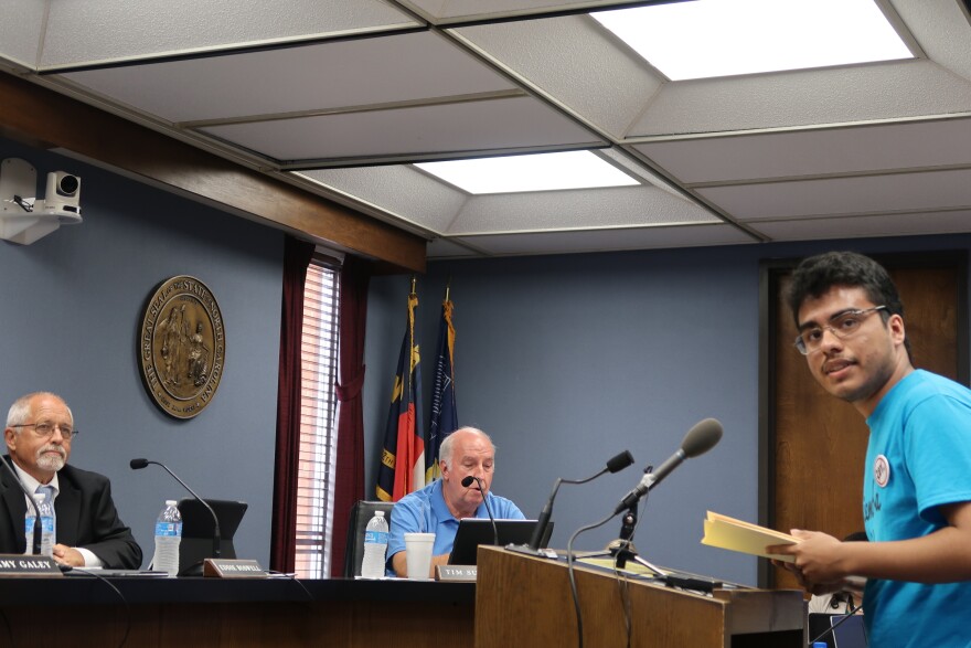 Sixteen year-old Milton Marin addresses Alamance County Commissioners, including Eddie Boswell and Tim Sutton, to ask that they reject any proposal to reinstate an agreement with ICE for the county to participate in the 287(g) program.