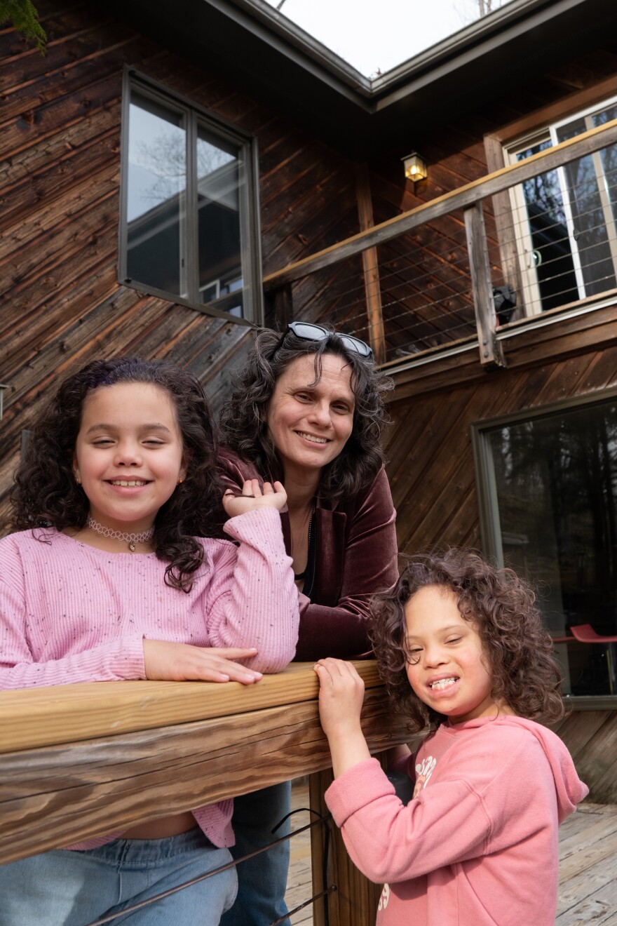 Sybriea Lundy and her two daughters outside their rental home in Asheville.