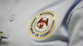 The logo of the Mississippi Department of Corrections is shown on the shirt of a corrections officer on Tuesday, May 9, 2023, at Central Mississippi Correctional Facility in Pearl, Miss.