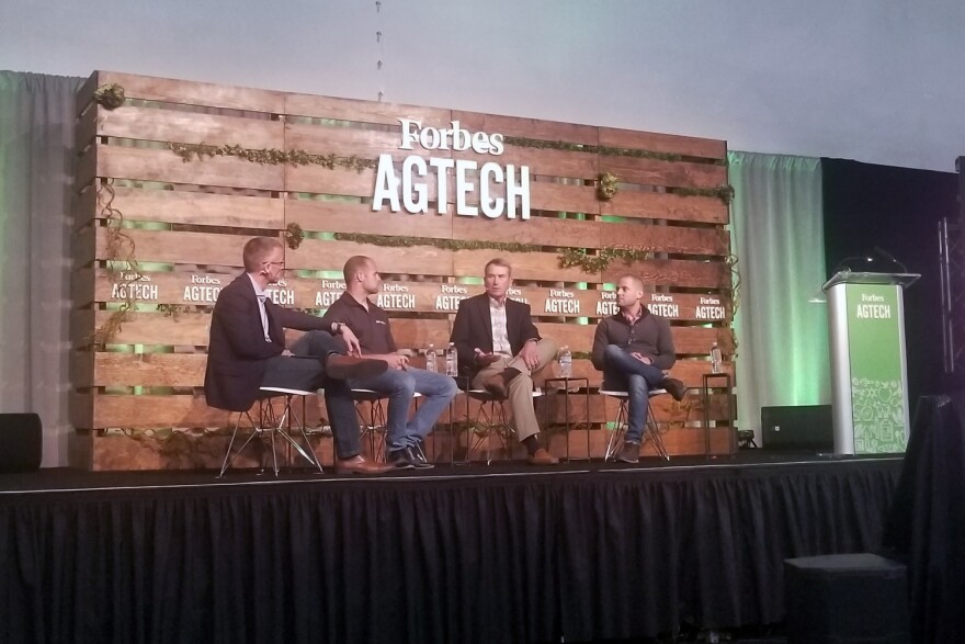 (From left to right) Reynolds Farm Equipment CEO Mitch Frazier talks with panelists AgNext CEO Troy Fiechter, farmer Jim Kline, and Taranis head of marketing Alex Whitley during Forbes AgTech Summit in Indianapolis.