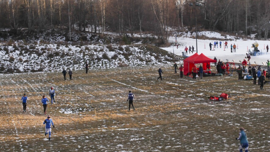 High school skiers warm up for the annual Lynx Loppet race at Kincaid Park. Competitors had to warm up by running with their ski poles.