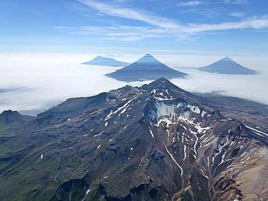 A mpuntain top covered in clouds