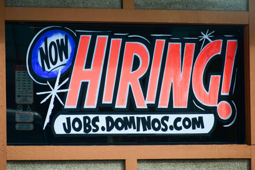 A hiring sign on a Domino's pizza location in South Bend.