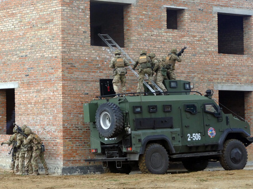 Soldiers storm a building during a drill held as part of the Exercise Rapid Trident 2019, an annual multinational training exercise near Yavoriv, Ukraine.