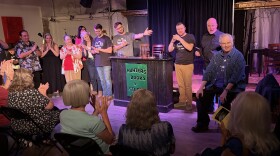 The audience applauds Steven McGaw, far right, during the curtain call on opening night of SceneShop's "Don't Dream It's Over."