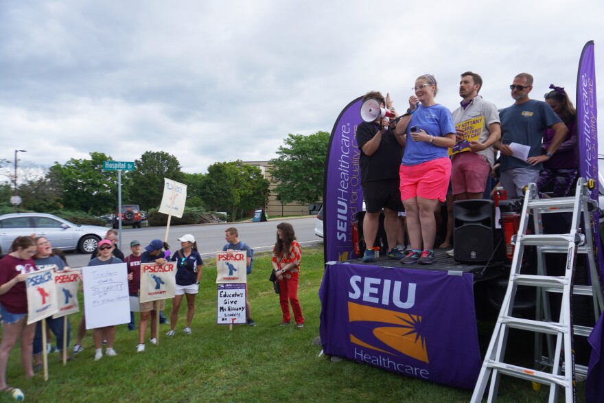 Hope Jasper (wearing pink shorts on the right) is a hospital employee at the Mount Nittany Medical Center. She said she had to delay cancer treatments for her husband because hospital leaders paused health insurance for workers who went on strike. 