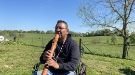 Flute maker Fred Nez Keams plays an impromptu song.