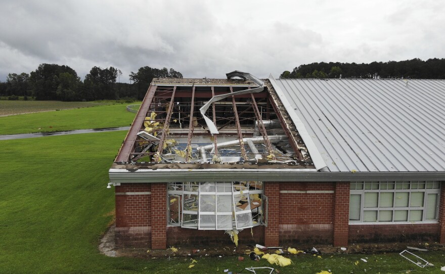 Debris from a tornado spun off by the remnants of Tropical Storm Debby, litters the campus of Springfield Middle School in Lucama, N.C., on Thursday, Aug. 8, 2024.