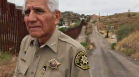 In this Dec. 5, 2017, photo, Santa Cruz County Sheriff Tony Estrada poses for a photo in Nogales, Ariz., on the U.S. side of the international boundary with Nogales, Mexico, where he was born. Estrada is a critic of President Trump's immigration policies and plans for a "big, beautiful" border wall. (Anita Snow/AP)