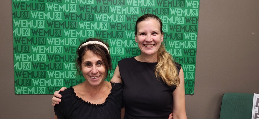 Washtenaw United host Decky Alexander and SafeHouse Center executive director Christine Watson at the Timko Broadcast Center.