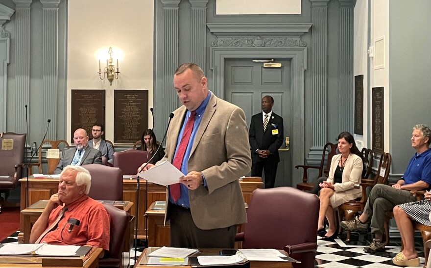  Senate Minority Leader Brian Pettyjohn asks to table the resolution to remove McGuiness from office as she looks on from the wings of the Senate chambers.