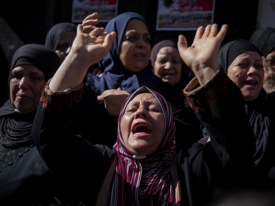 Palestinian relatives mourn for Imad Hashash, 15, who was killed in clashes with Israeli security forces early Tuesday morning. Palestinian authorities said Hashash died after being shot in the head during clashes with soldiers. Israel's military said soldiers were carrying out an arrest raid when they came under attack from nearby rooftops by Palestinians who fired guns and threw stone blocks.